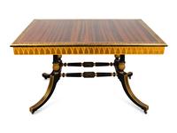 A Regency Style Macassar, Parcel-Gilt and Ebonized Library Table — 20TH CENTURY