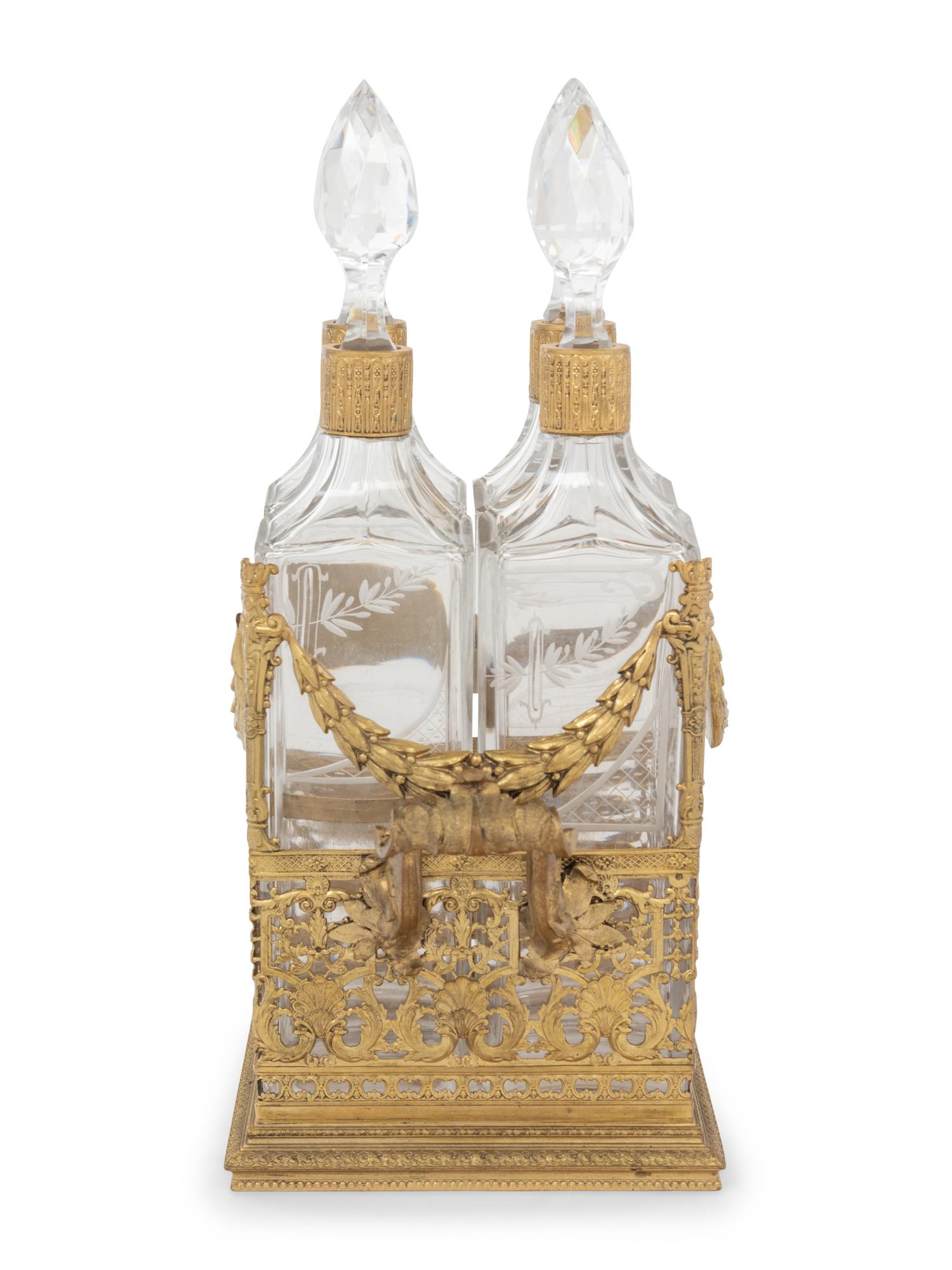 A French Gilt Metal and Glass Four-Bottle Decanter Caddy