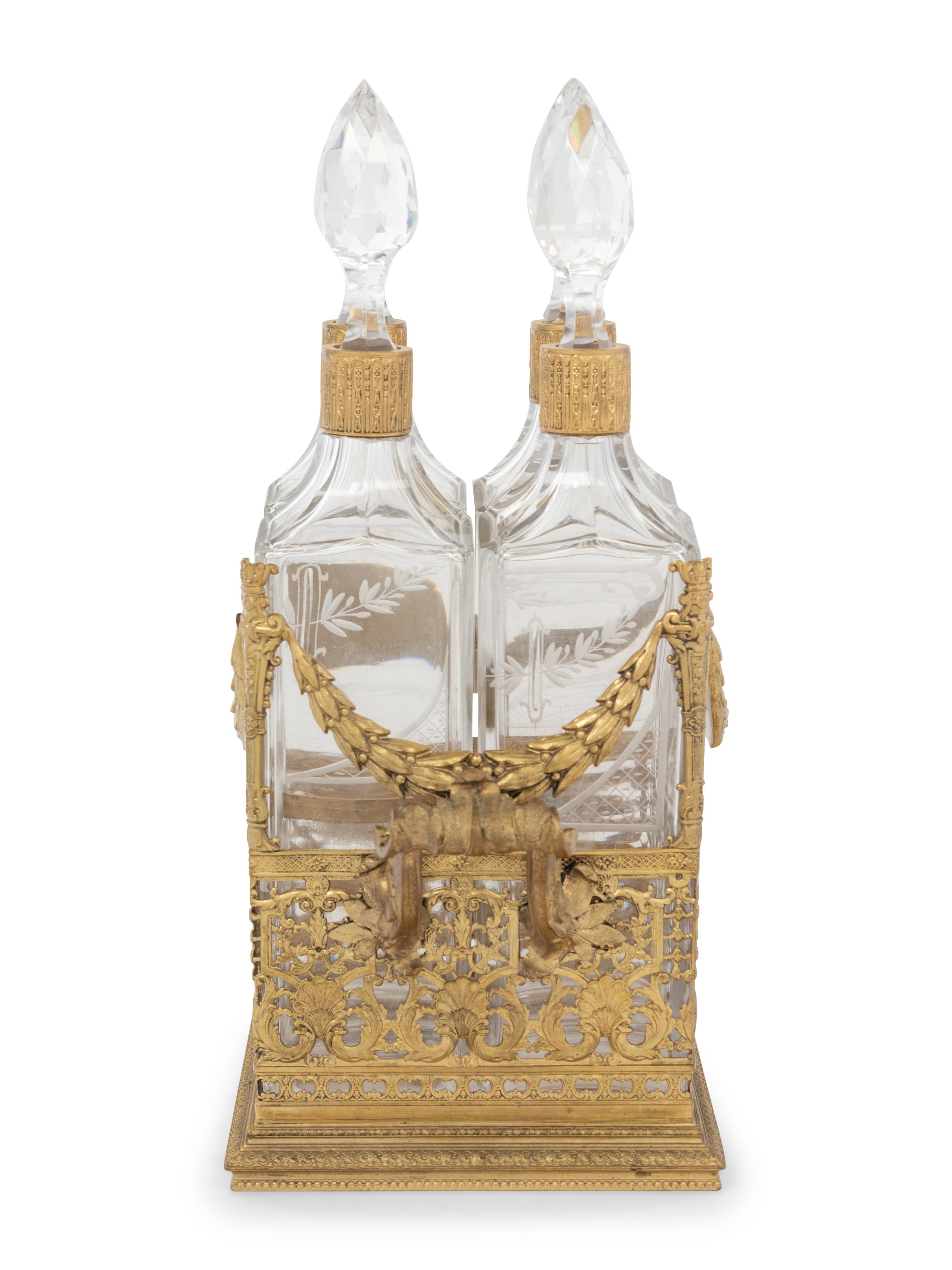 A French Gilt Metal and Glass Four-Bottle Decanter Caddy