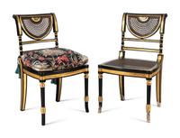 A Set of Eight Regency Style Black Painted and Parcel Gilt Dining Chairs