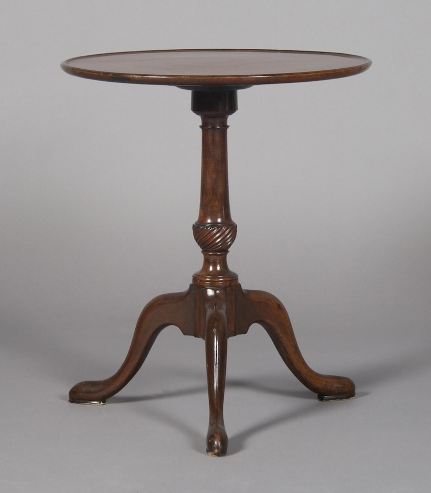 A Georgian Style Mahogany Tripod Table, Height 22 1/4 x diameter 18 3/4 inches.