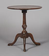 A Georgian Style Mahogany Tripod Table, Height 22 1/4 x diameter 18 3/4 inches.