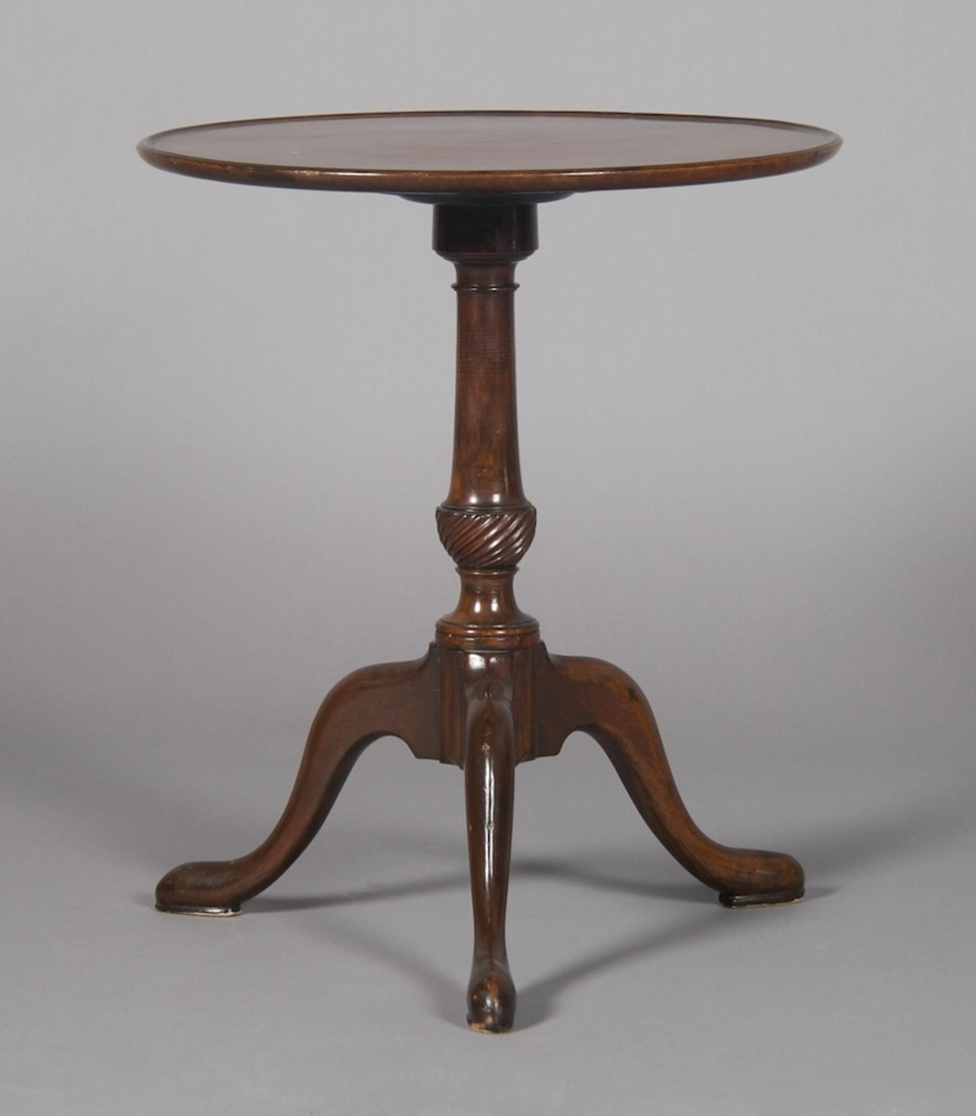 A Georgian Style Mahogany Tripod Table, Height 22 1/4 x diameter 18 3/4 inches.