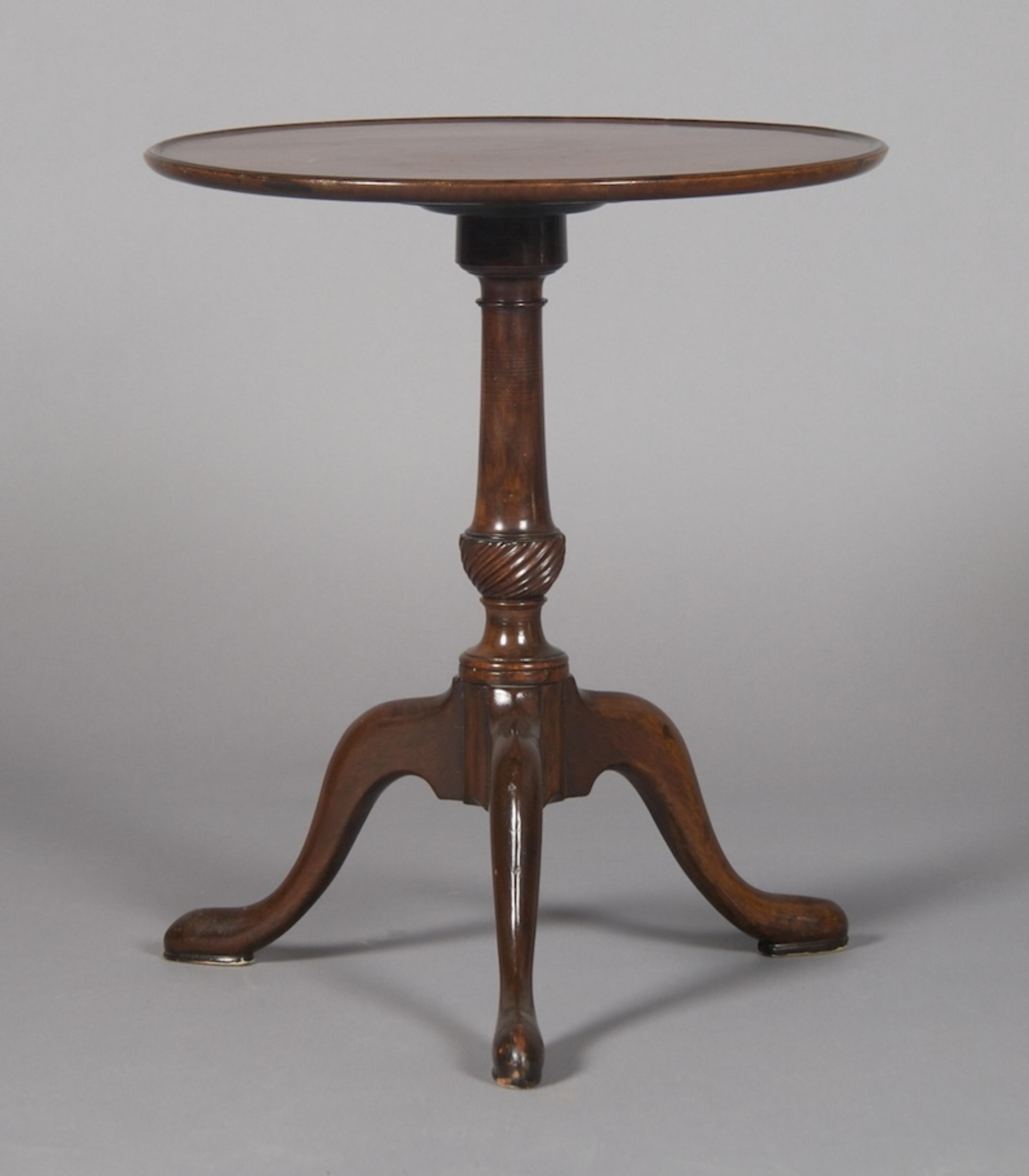 A Georgian Style Mahogany Tripod Table, Height 22 1/4 x diameter 18 3/4 inches.