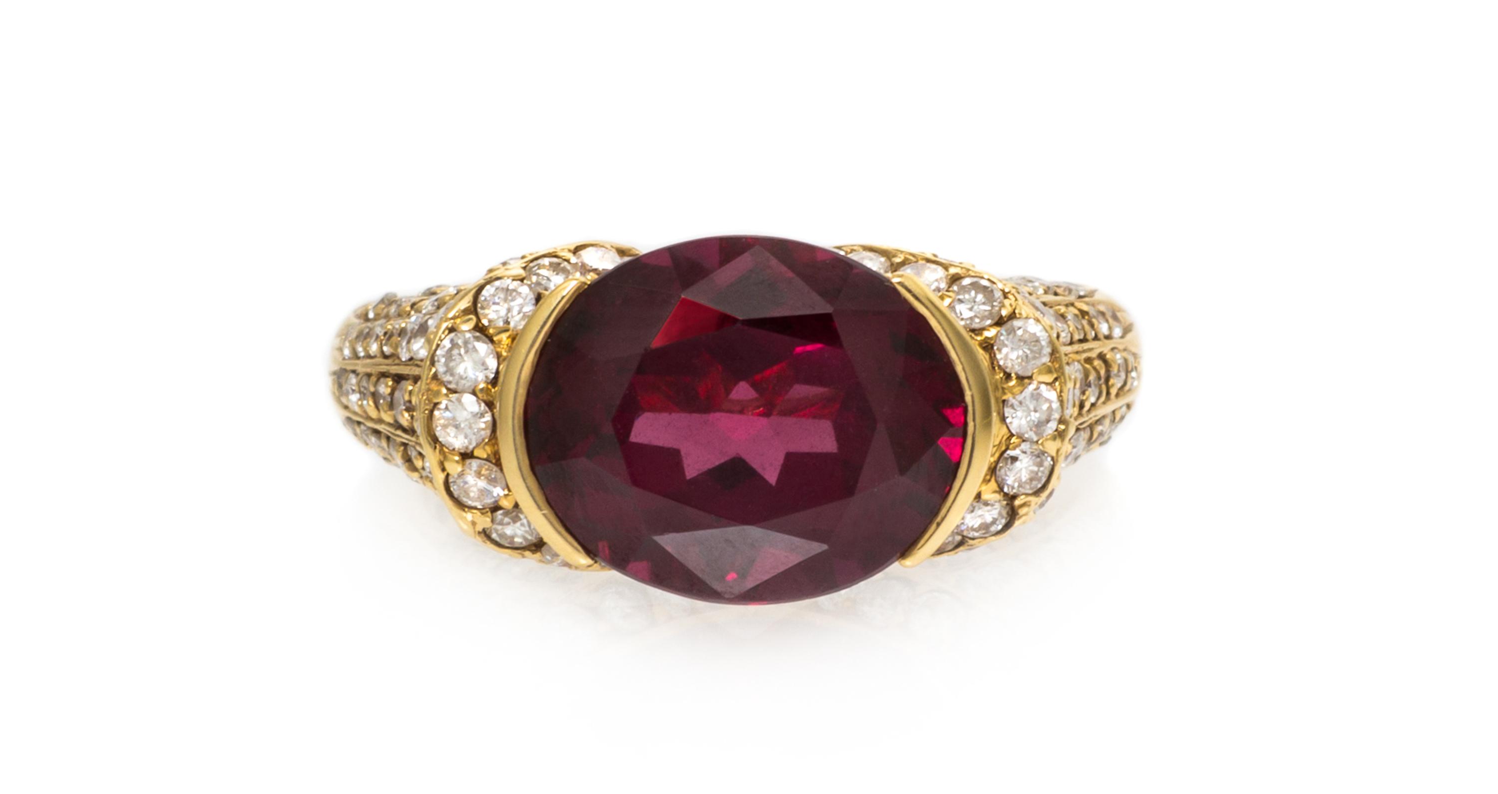 An 18 Karat Yellow Gold, Garnet and Diamond Ring, 5.50 dwts.