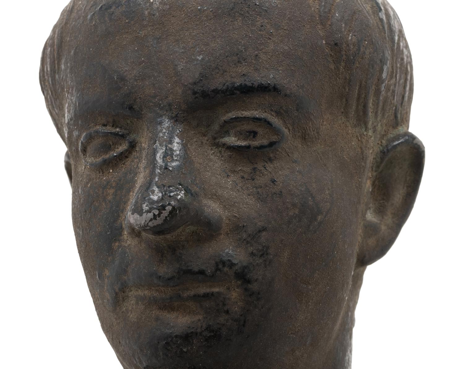 A Cast Metal Bust of a Man