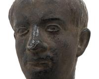 A Cast Metal Bust of a Man