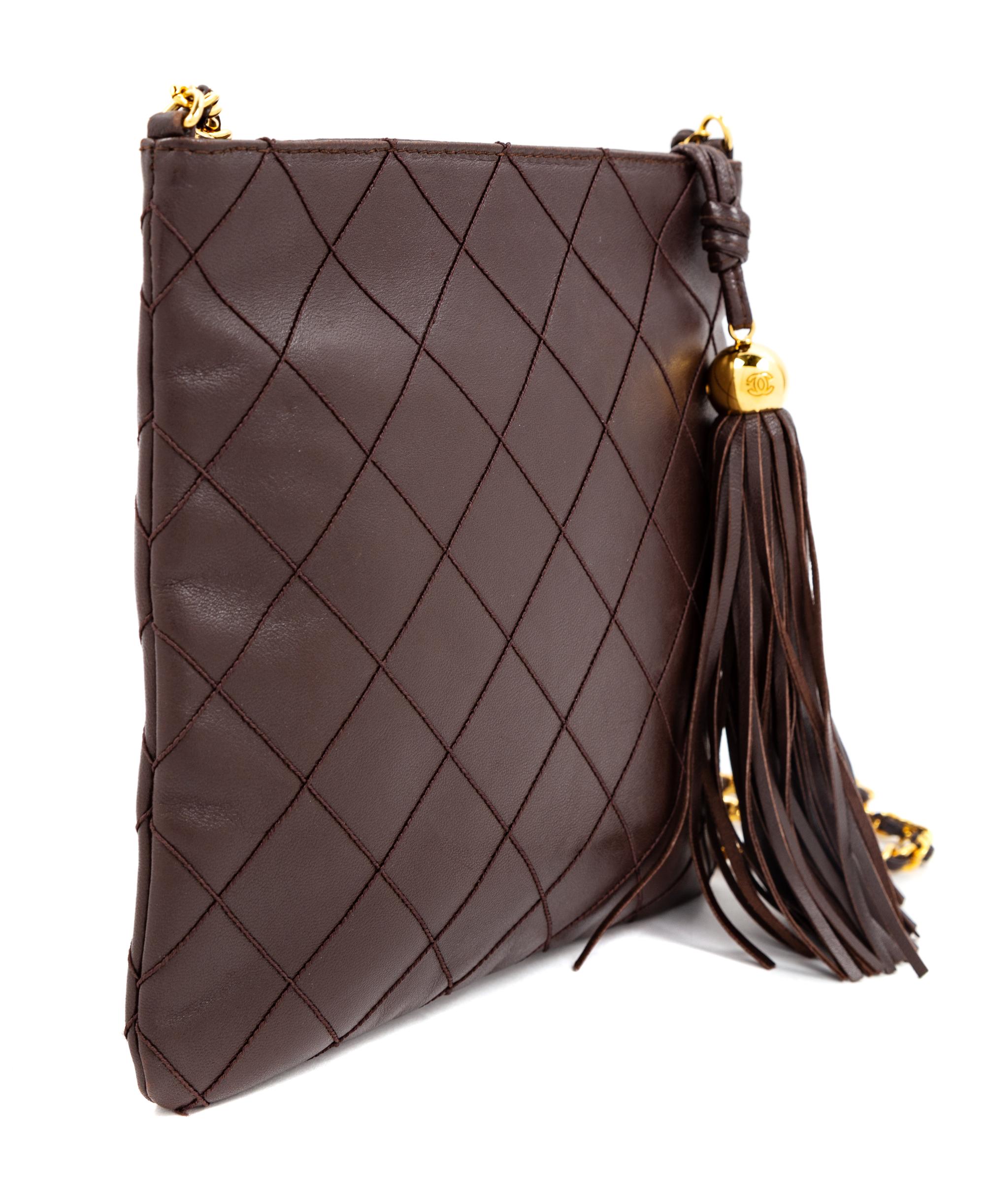 A Chanel Dark Brown Quilted Cross Body Bag, 7.5" H x 8.25" W; Strap drop: 19".