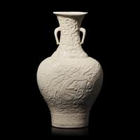 A Chinese White Glazed Soft Paste Molded 'Dragons and Lingzhi' Vase, 18th Century 清中期 白釉模印漿胎靈芝螭龍紋瓶