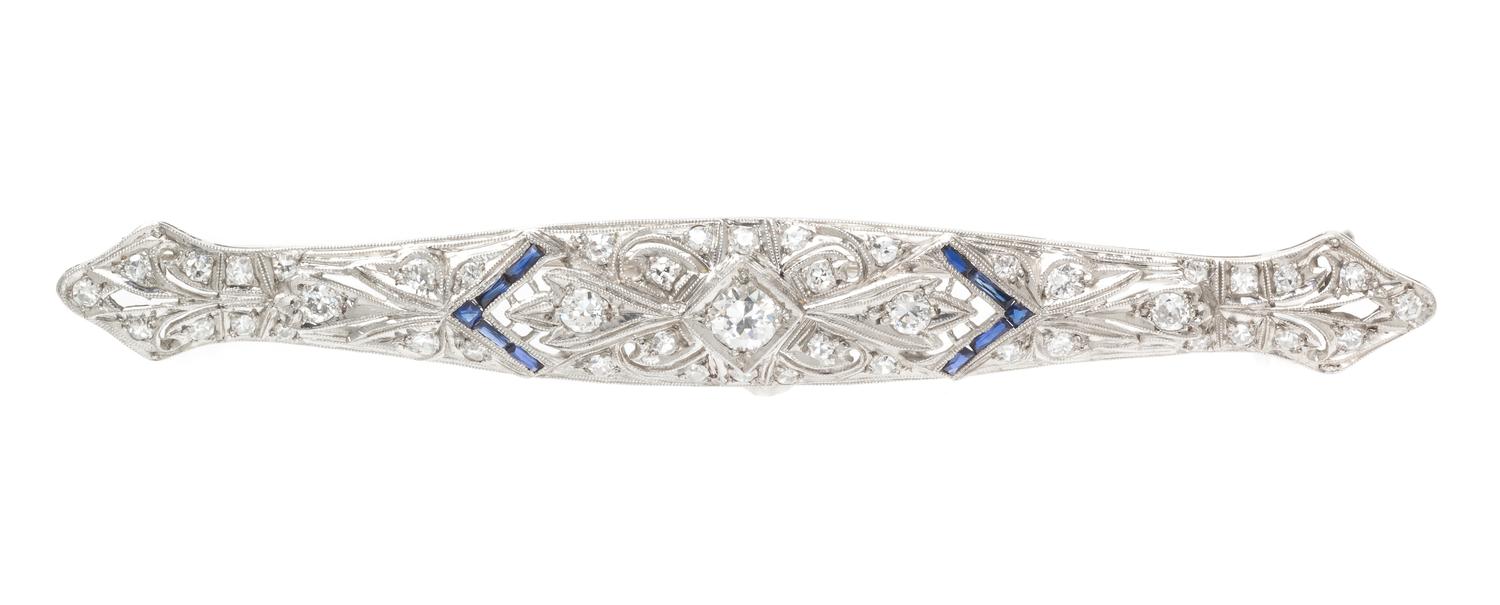 A Platinum, Diamond and Synthetic Sapphire Bar Brooch, 6.40 dwts.