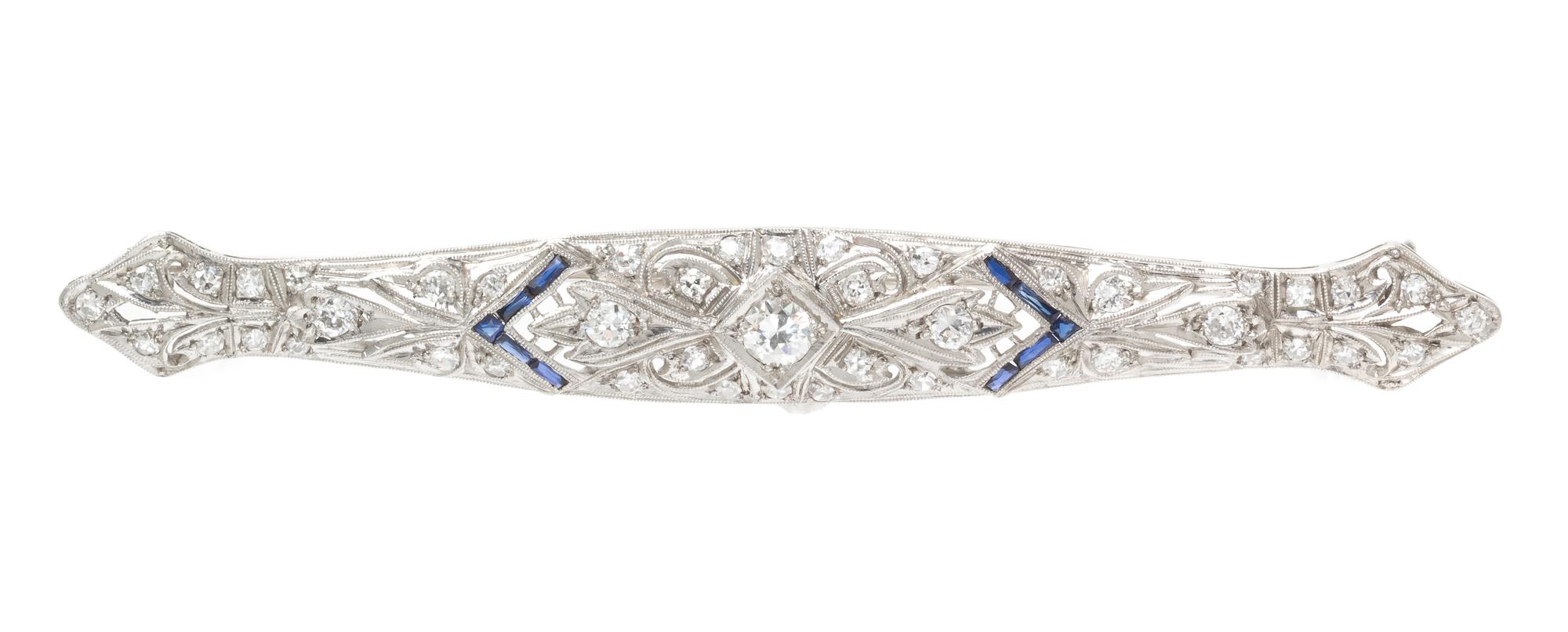 A Platinum, Diamond and Synthetic Sapphire Bar Brooch, 6.40 dwts.