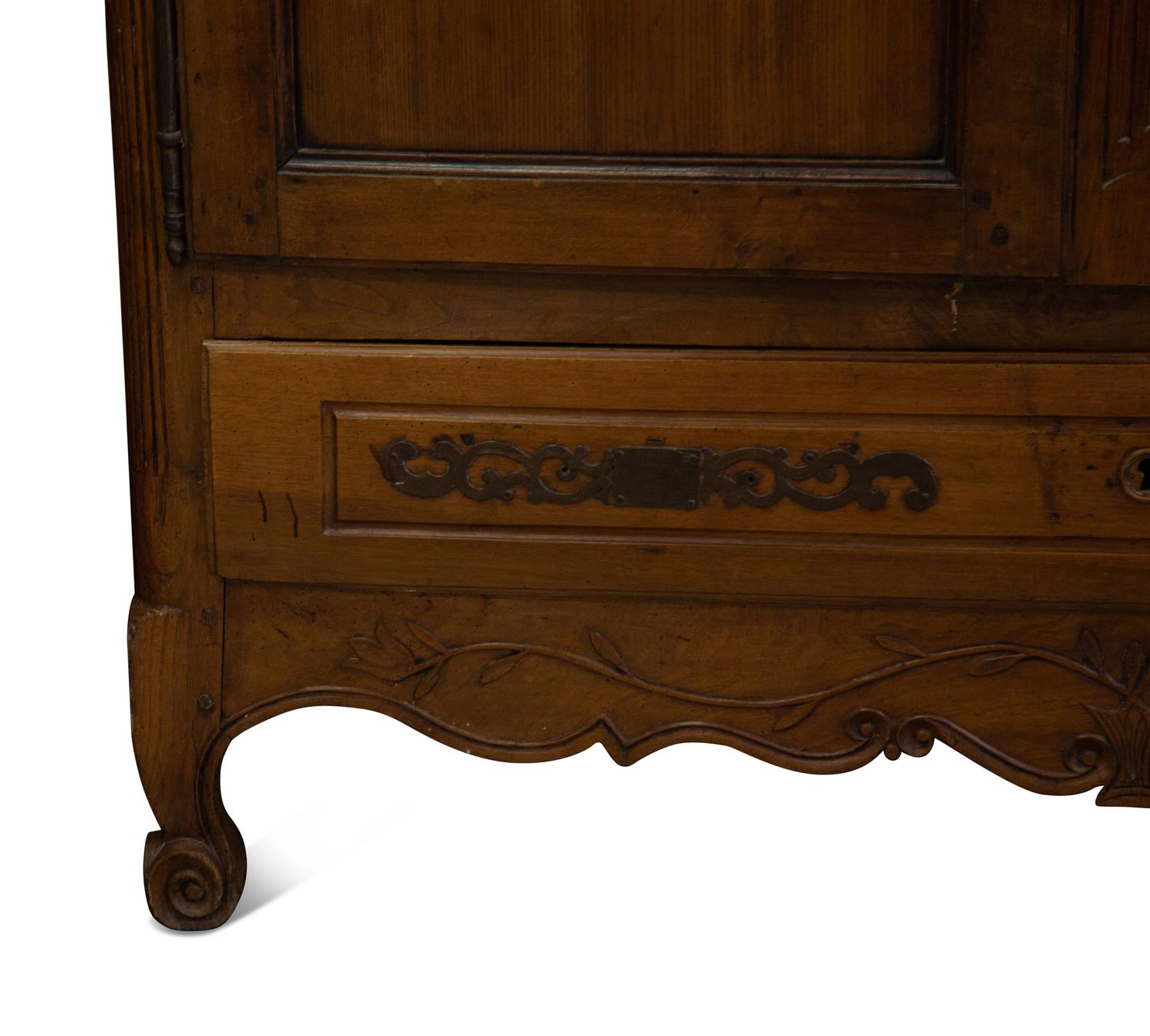 A French Provincial Carved Walnut Armoire