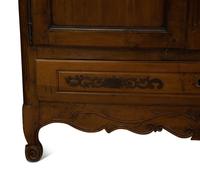 A French Provincial Carved Walnut Armoire