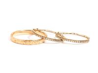 COLLECTION OF YELLOW GOLD BANGLE BRACELETS