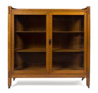 Arts and Crafts, FIRST HALF 20TH CENTURY, bookcase, having three-quarter galleried top over two glazed doors
