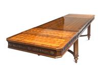 A Louis XVI Style Parcel Gilt Parquetry and Walnut Dining Table