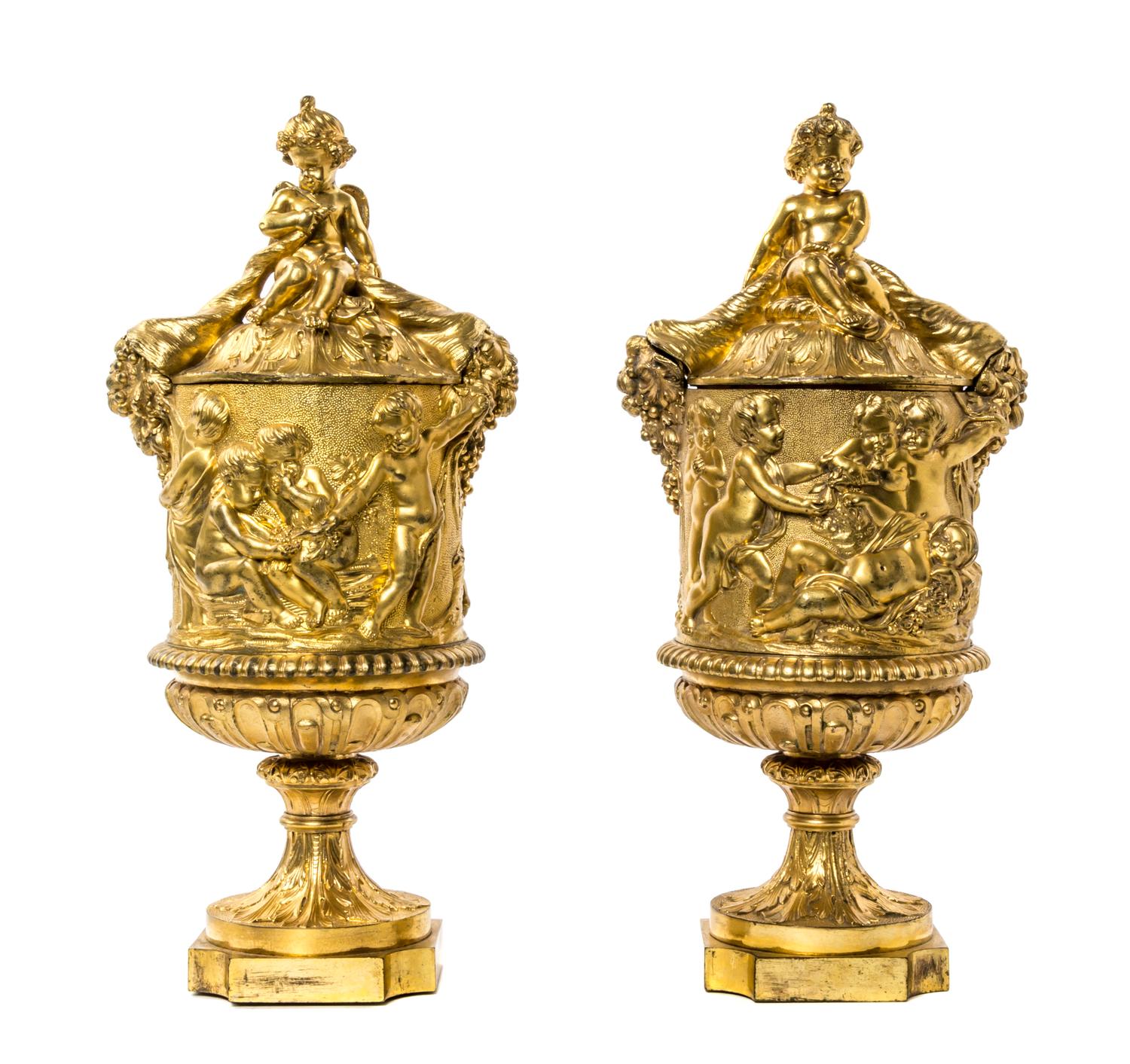 A Pair of Neoclassical Gilt Bronze Covered Urns, Height 15 inches.