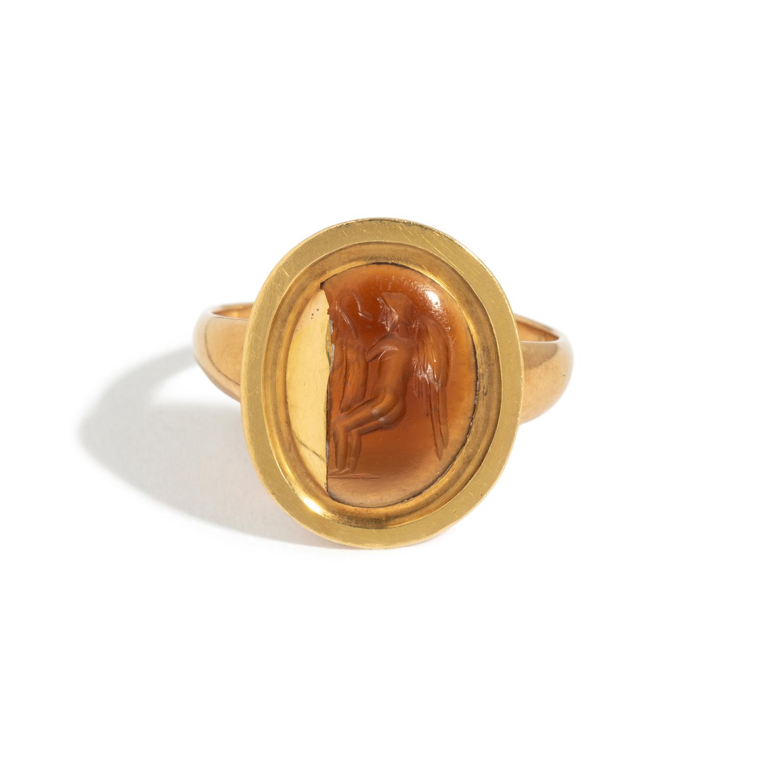 A Roman Carnelian Ring Stone with the God Eros Playing with a Swan — Set in a gold ring