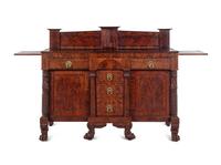 A Late Classical Carved and Highly Figured Mahogany Sideboard
