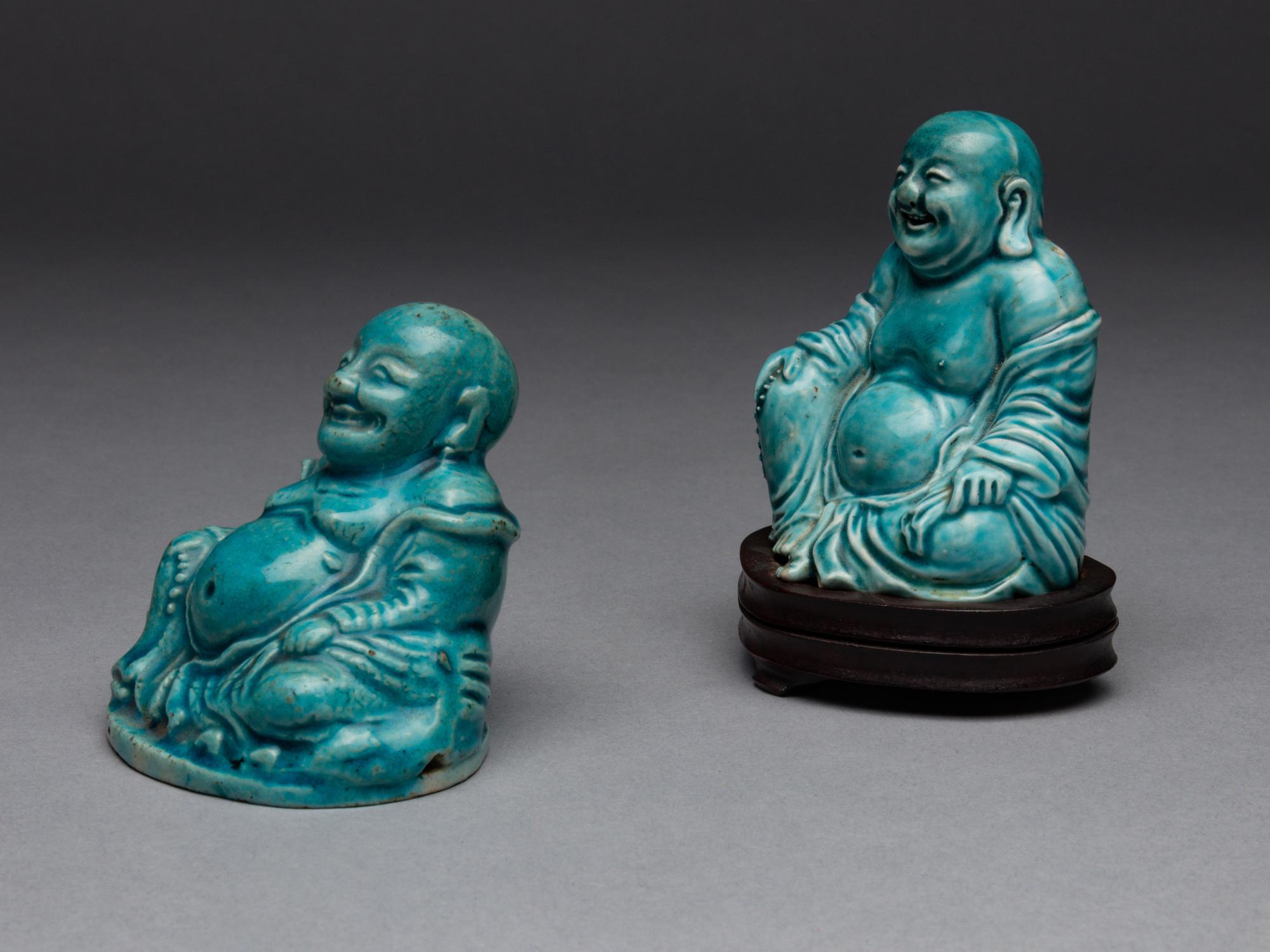 Two Turquoise Glazed Porcelain Figures of Budai Buddhas