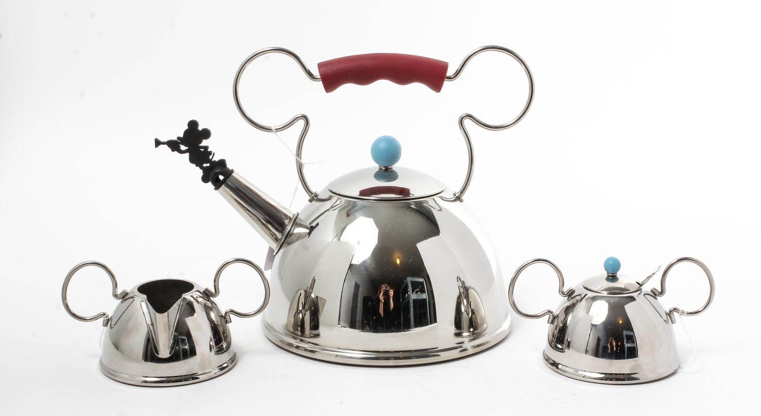 A Stainless Steel Partial Tea Service Height of kettle 9 x width 11 3/4 inches. — DESIGNED BY MICHAEL GRAVES FOR MOLLER DESIGN, 1991