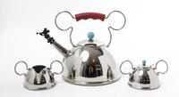 A Stainless Steel Partial Tea Service Height of kettle 9 x width 11 3/4 inches. — DESIGNED BY MICHAEL GRAVES FOR MOLLER DESIGN, 1991