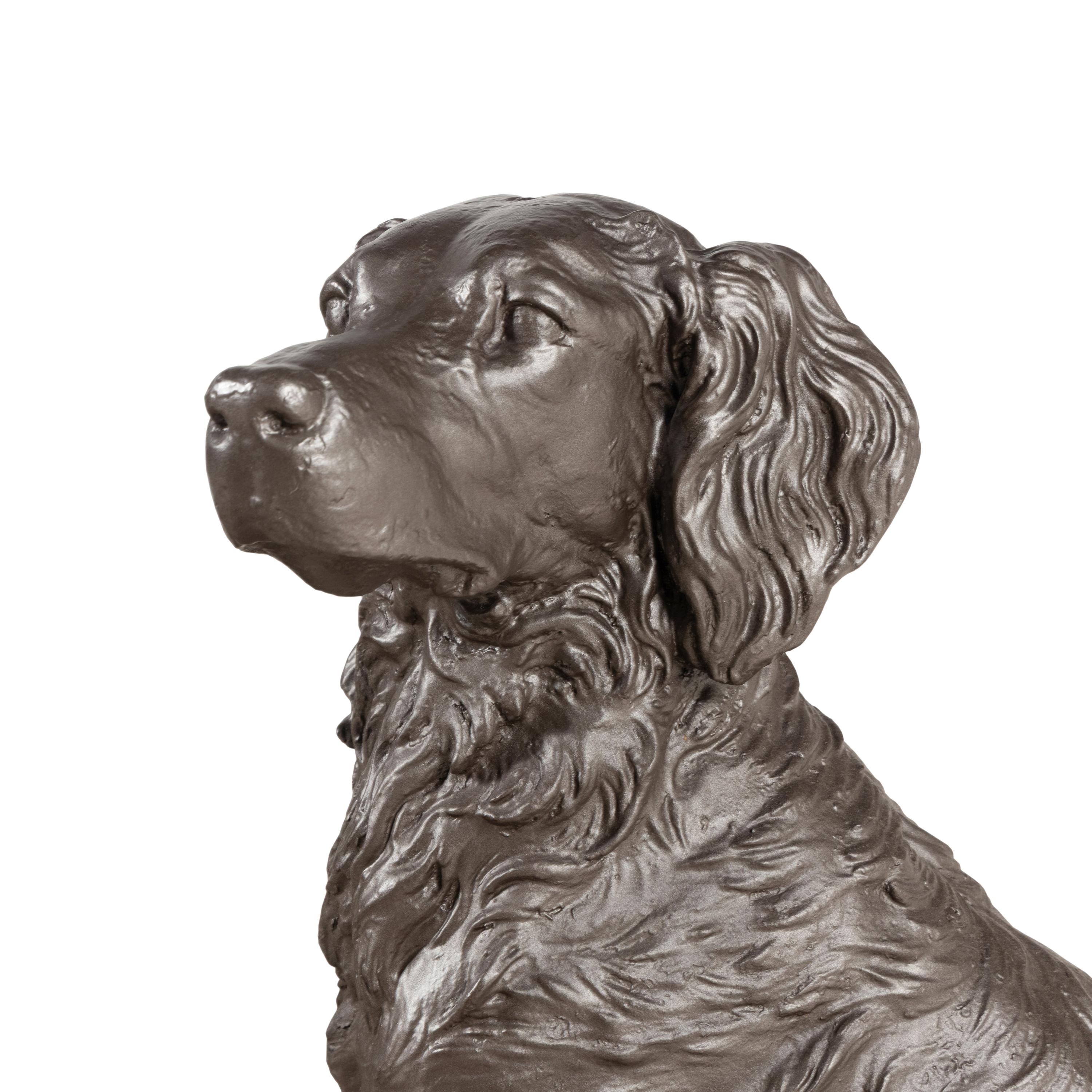 A Cast Iron Sculpture of a Dog
