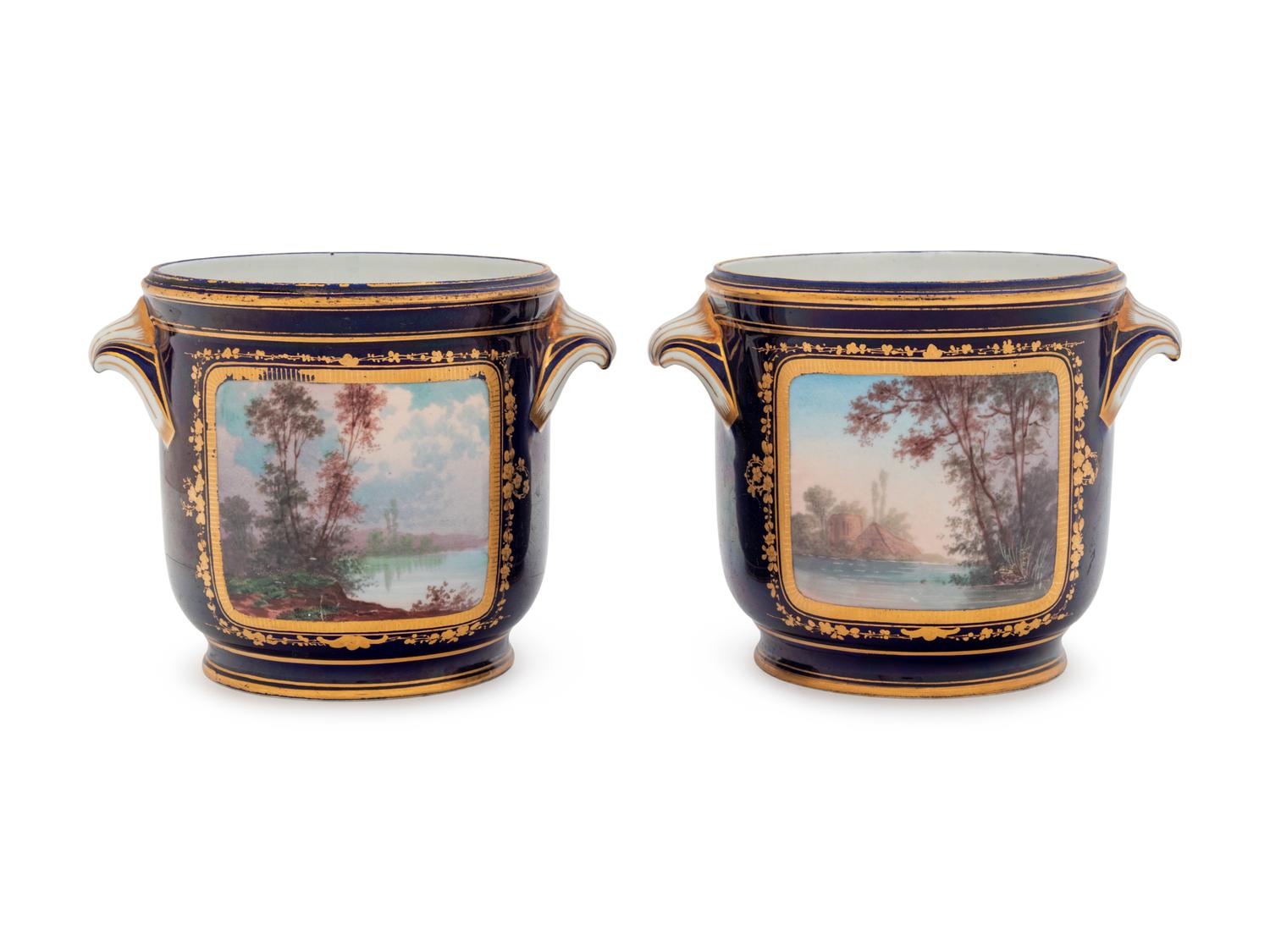 A Pair of Sèvres Style Painted and Parcel Gilt Porcelain Cache Pots