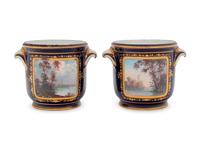 A Pair of Sèvres Style Painted and Parcel Gilt Porcelain Cache Pots