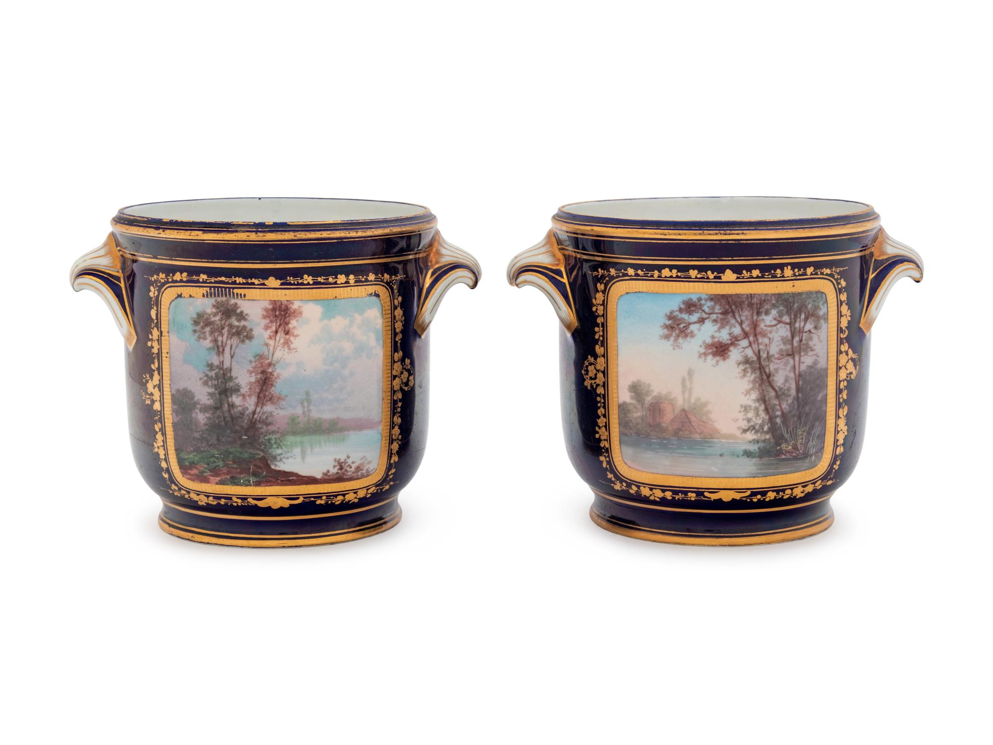 A Pair of Sèvres Style Painted and Parcel Gilt Porcelain Cache Pots