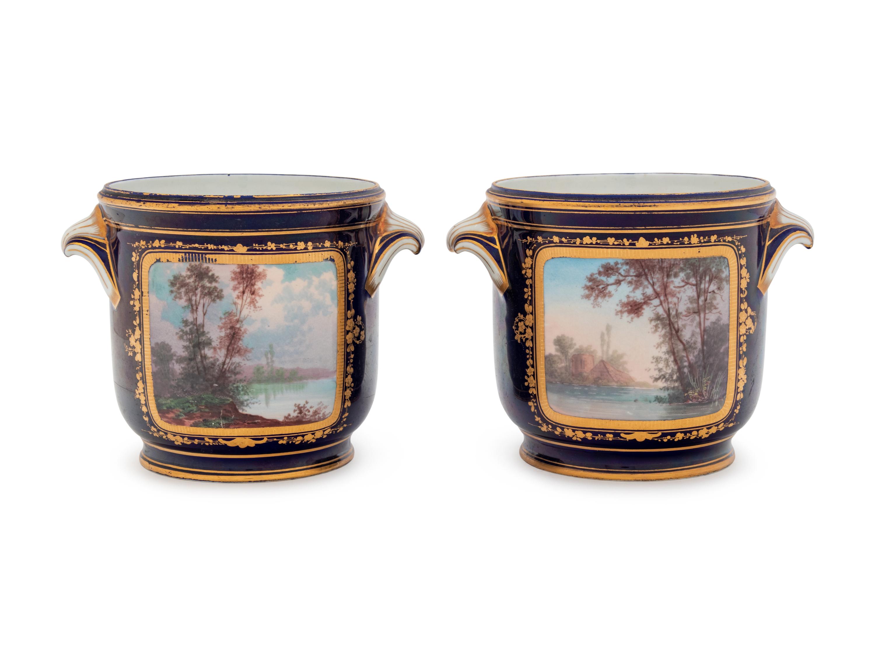 A Pair of Sèvres Style Painted and Parcel Gilt Porcelain Cache Pots