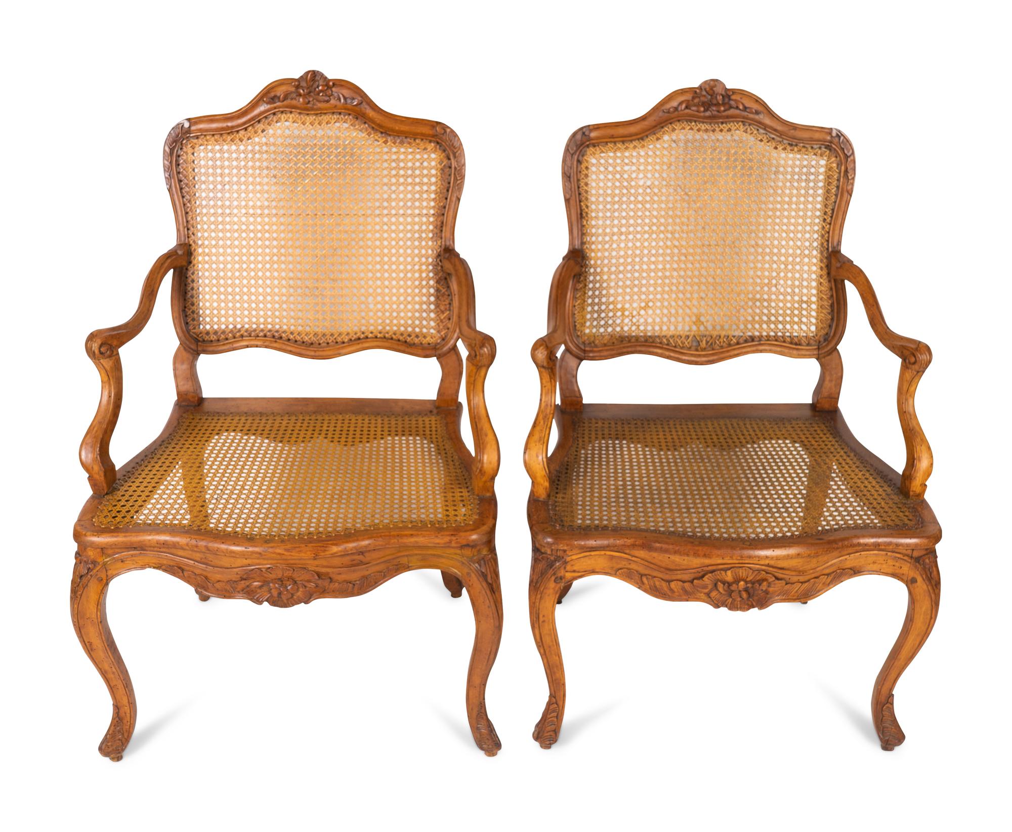 A Pair of Louis XV Style Carved Walnut Fauteuils — LATE 19TH CENTURY