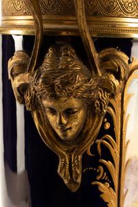 A Pair of Gilt Bronze Mounted Sèvres Style Porcelain Urns