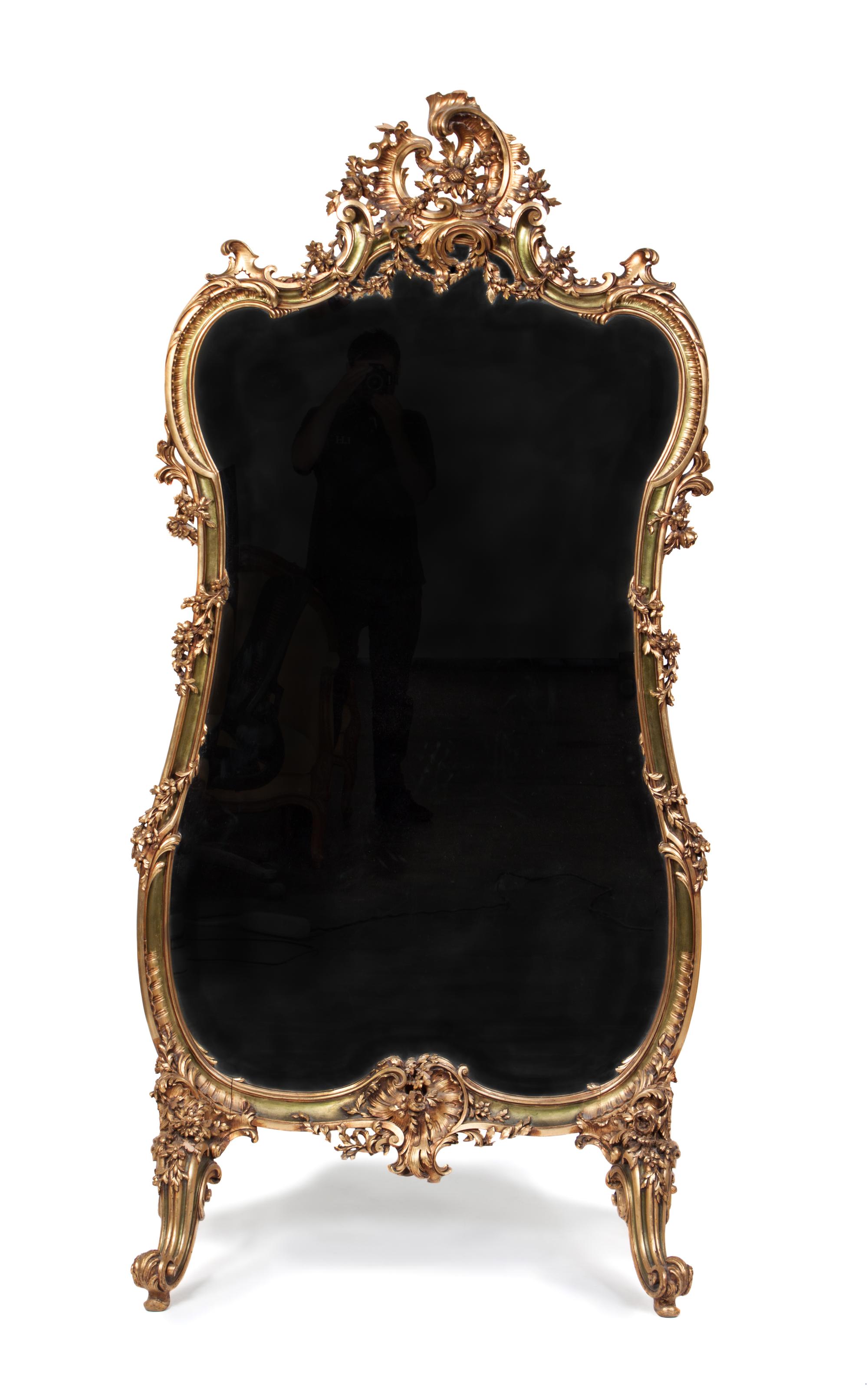 A Louis XV Style Giltwood Cheval Mirror Height 58 1/2 x width 34 1/2 inches.