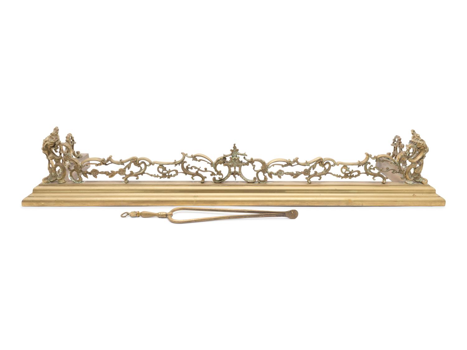 A Pair Continental Brass Andirons and a Fire Fender — LATE 19TH CENTURY