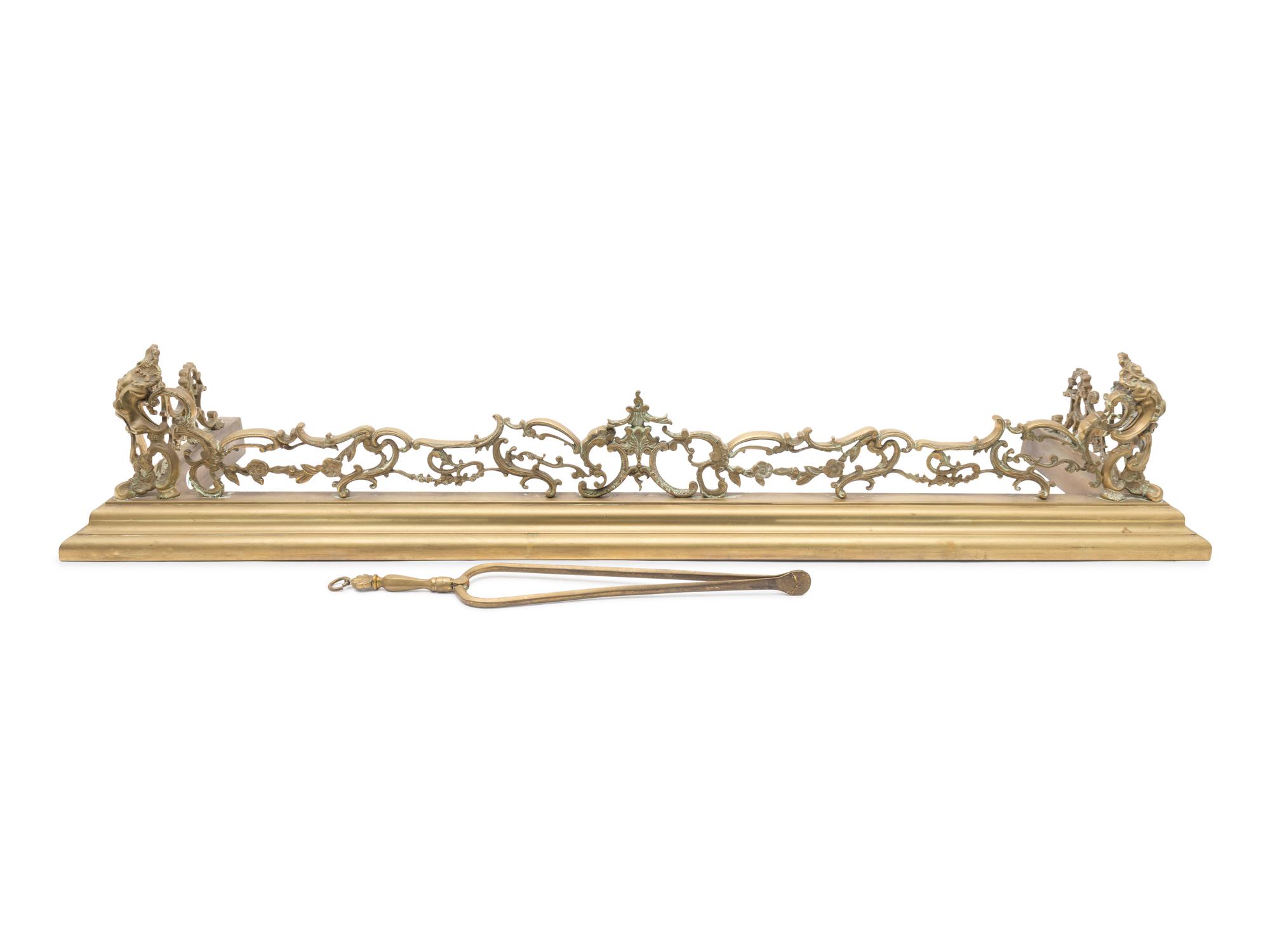 A Pair Continental Brass Andirons and a Fire Fender — LATE 19TH CENTURY