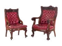 A Renaissance Revival Carved Mahogany Gentleman's and Lady's Chair Set