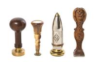 A Collection of Four Seals, Height of first 4 1/4 inches.