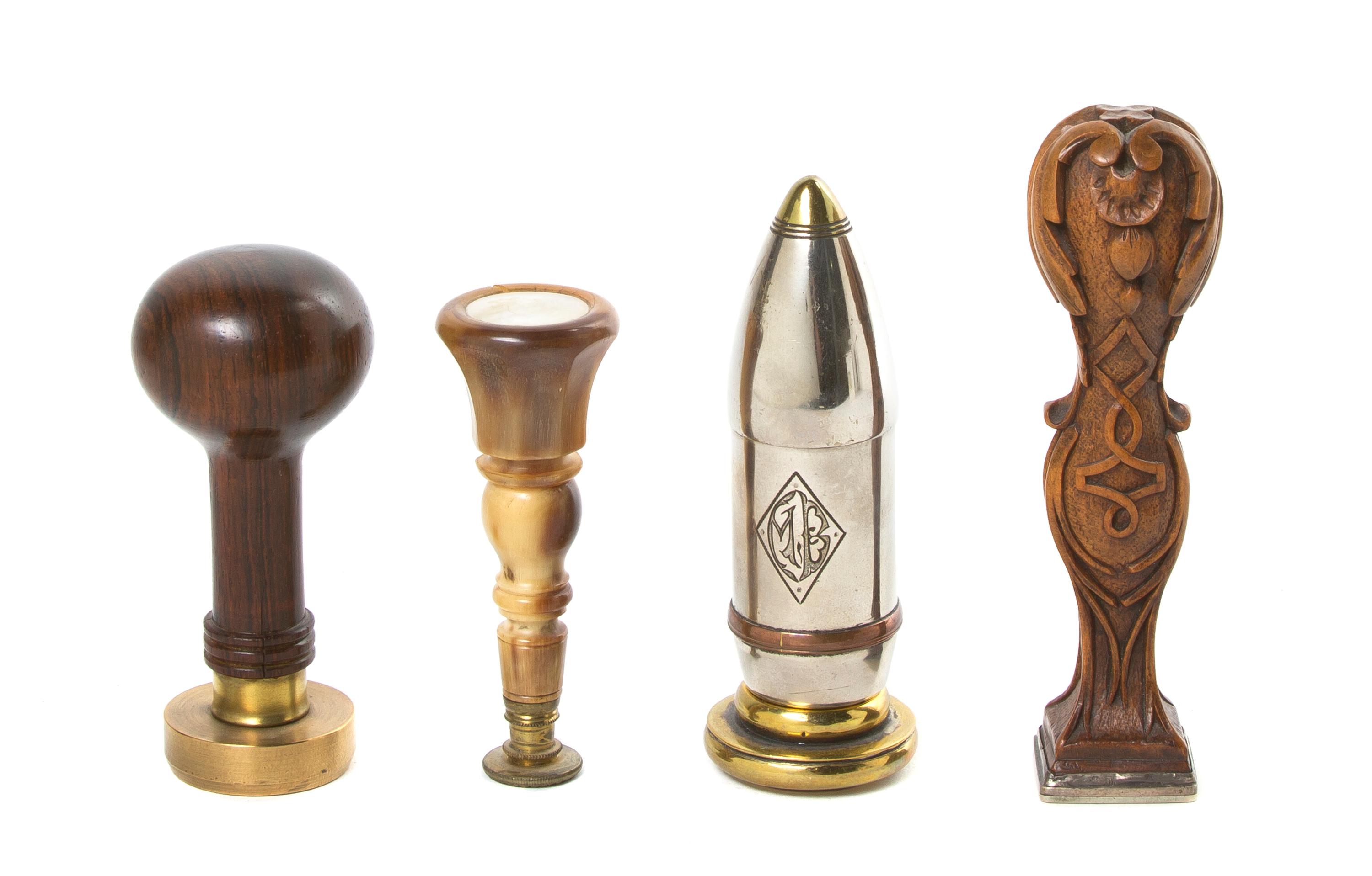 A Collection of Four Seals, Height of first 4 1/4 inches.