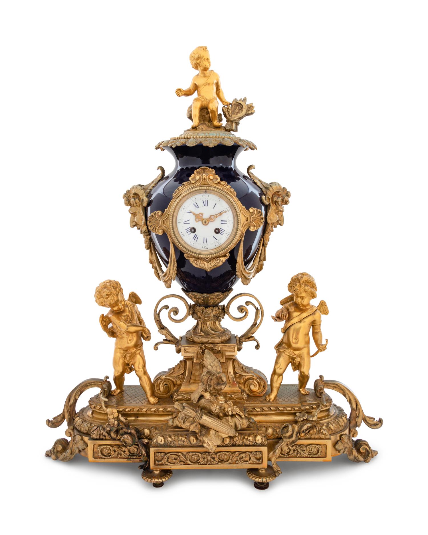 A Sèvres Style Gilt Bronze and Porcelain Mantel Clock