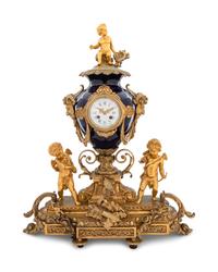 A Sèvres Style Gilt Bronze and Porcelain Mantel Clock