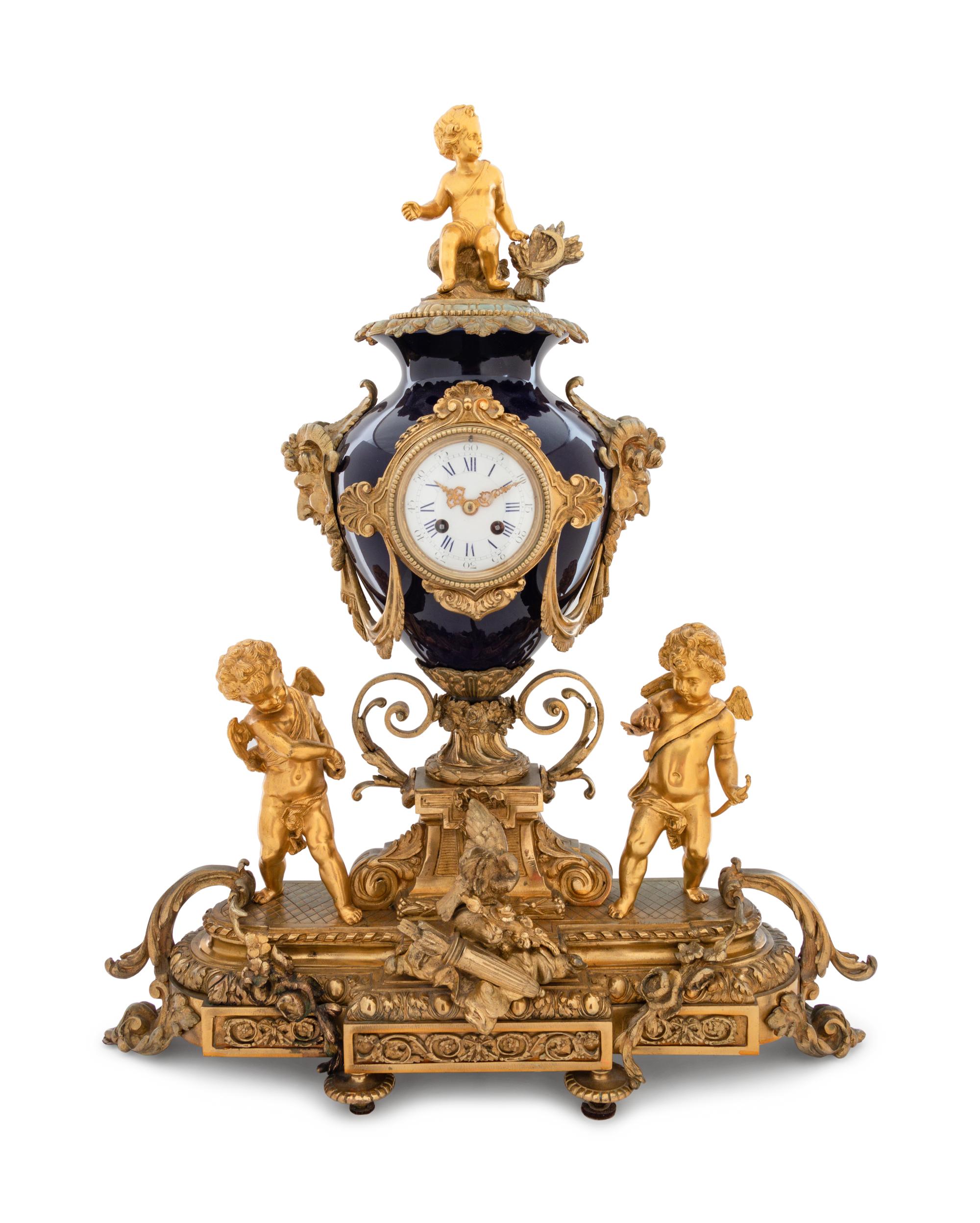A Sèvres Style Gilt Bronze and Porcelain Mantel Clock