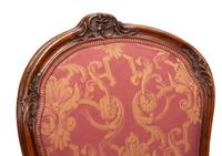 A Pair of Louis XV Style Carved Walnut Fauteuils