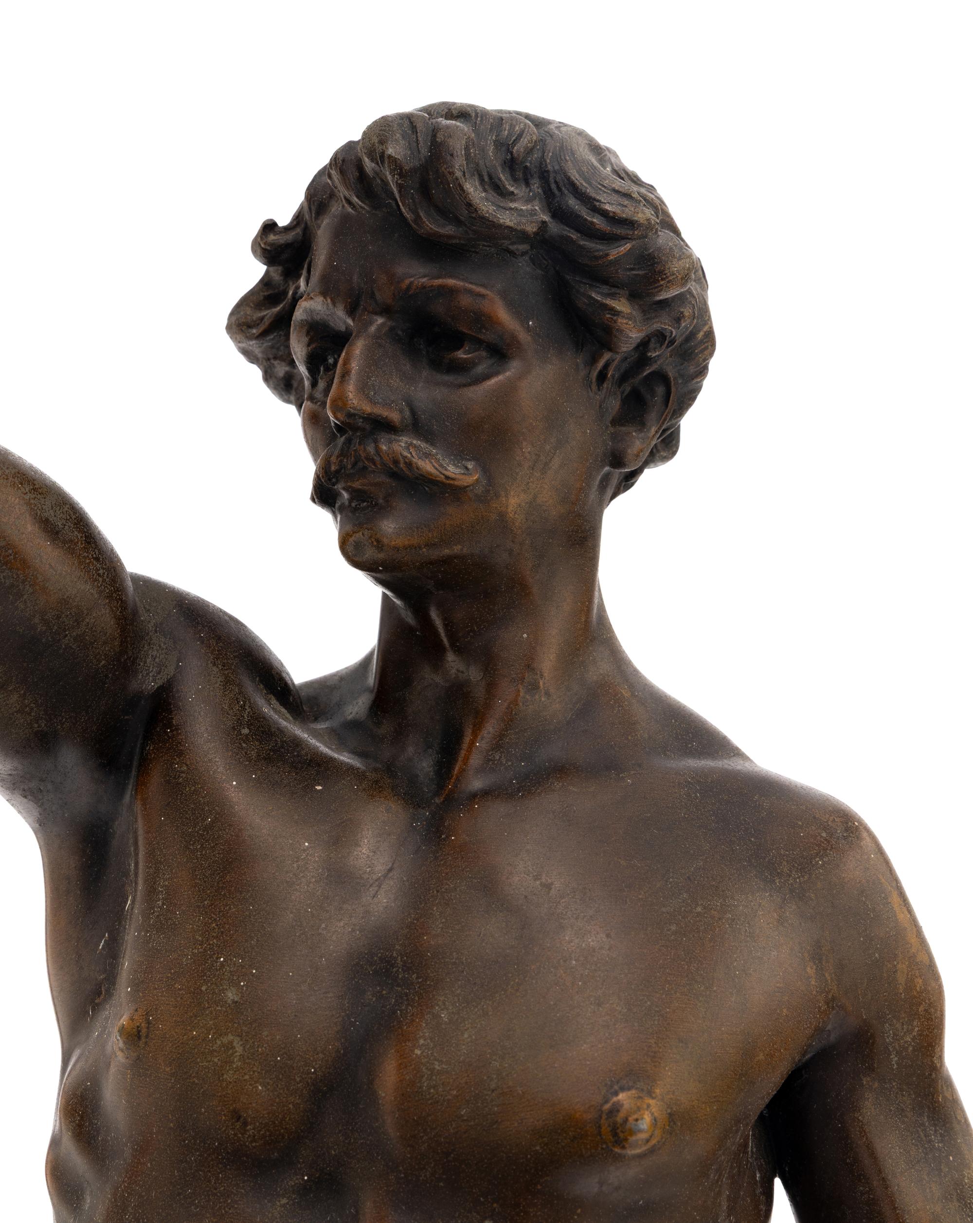 A Cast Metal Figural Newel Post Lamp