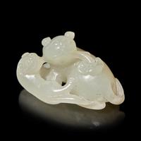 A Chinese Pale Celadon Jade ‘Double Badger' Group, Qing Dynasty — 清 青白玉雙歡珮