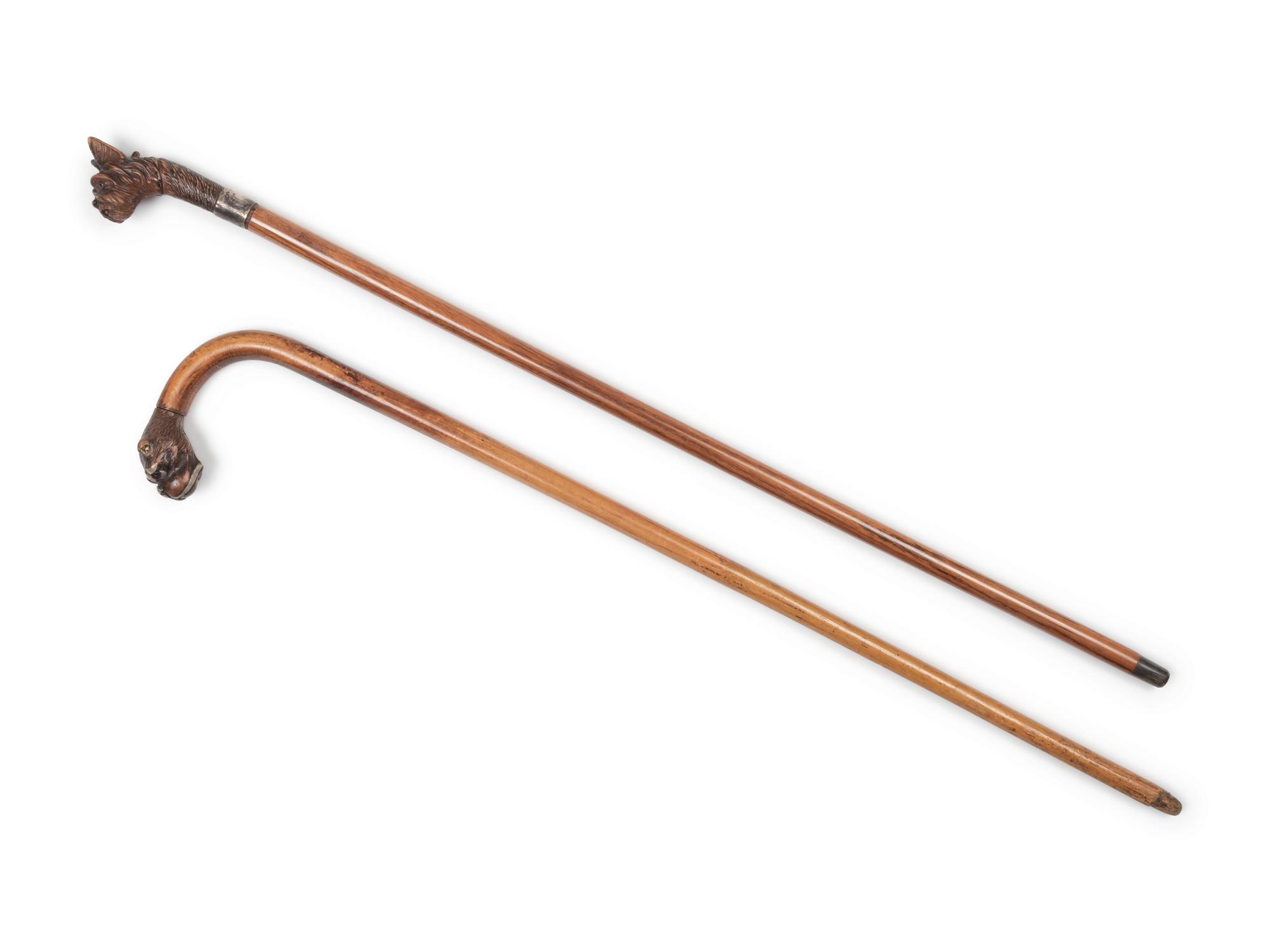 Two English Glass-Inset Carved Wood Dog's Head Canes