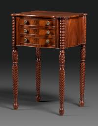 A Classical Carved Mahogany Three Drawer Work Table