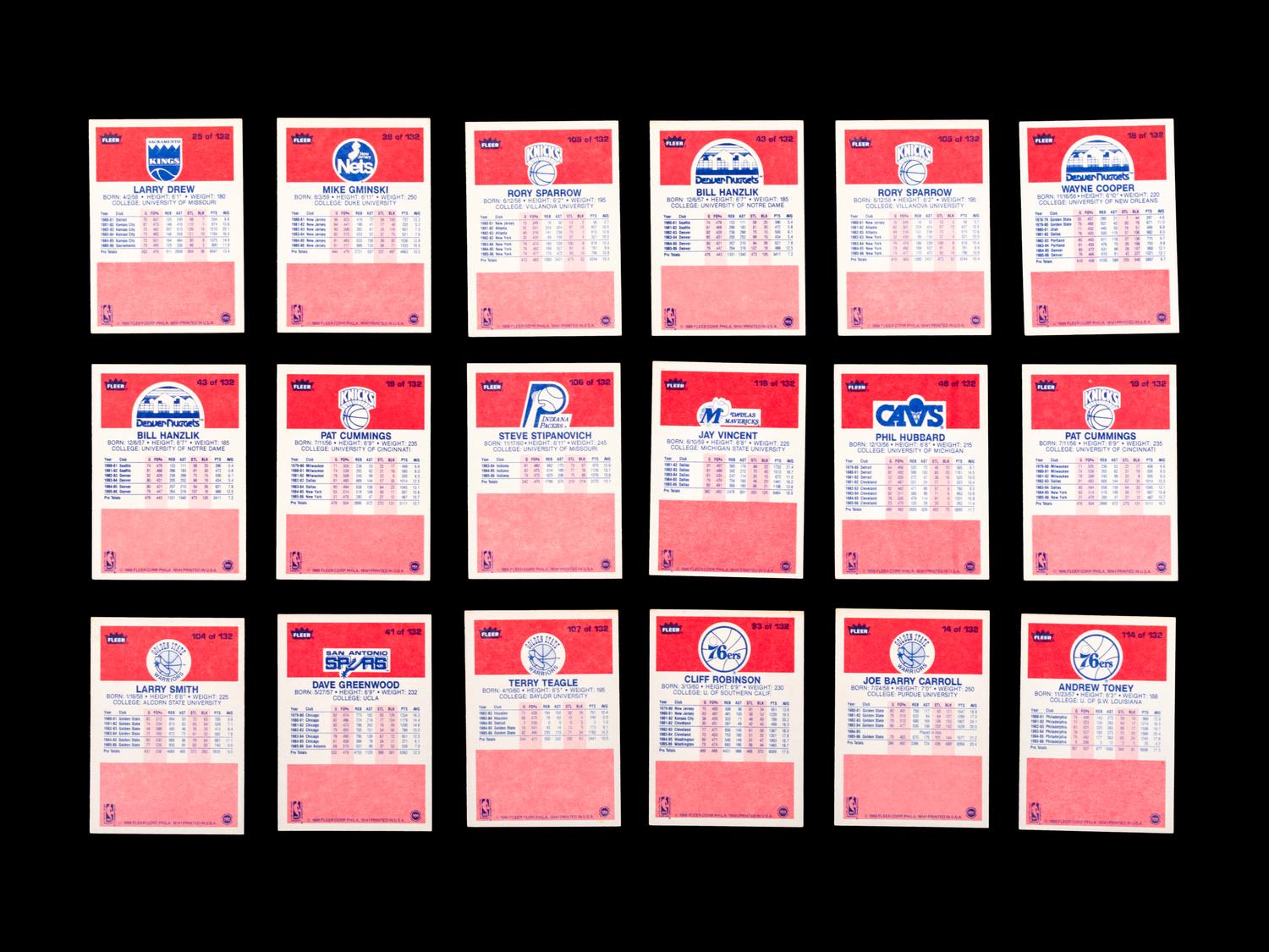 A Group of 71 1986 Fleer Basketball Cards and Stickers (Including Julius Erving, Patrick Ewing, Magic Johnson and Hakeem Olajuwon)