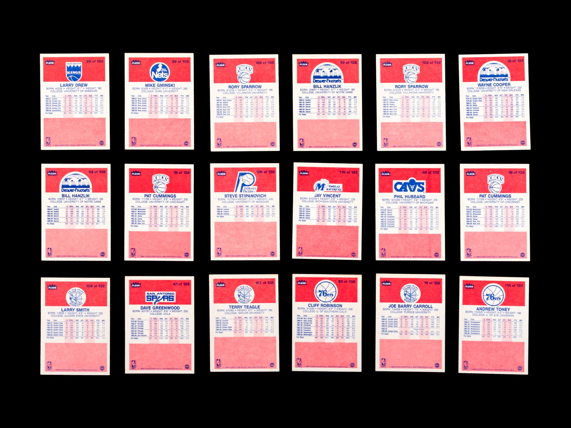 A Group of 71 1986 Fleer Basketball Cards and Stickers (Including Julius Erving, Patrick Ewing, Magic Johnson and Hakeem Olajuwon)