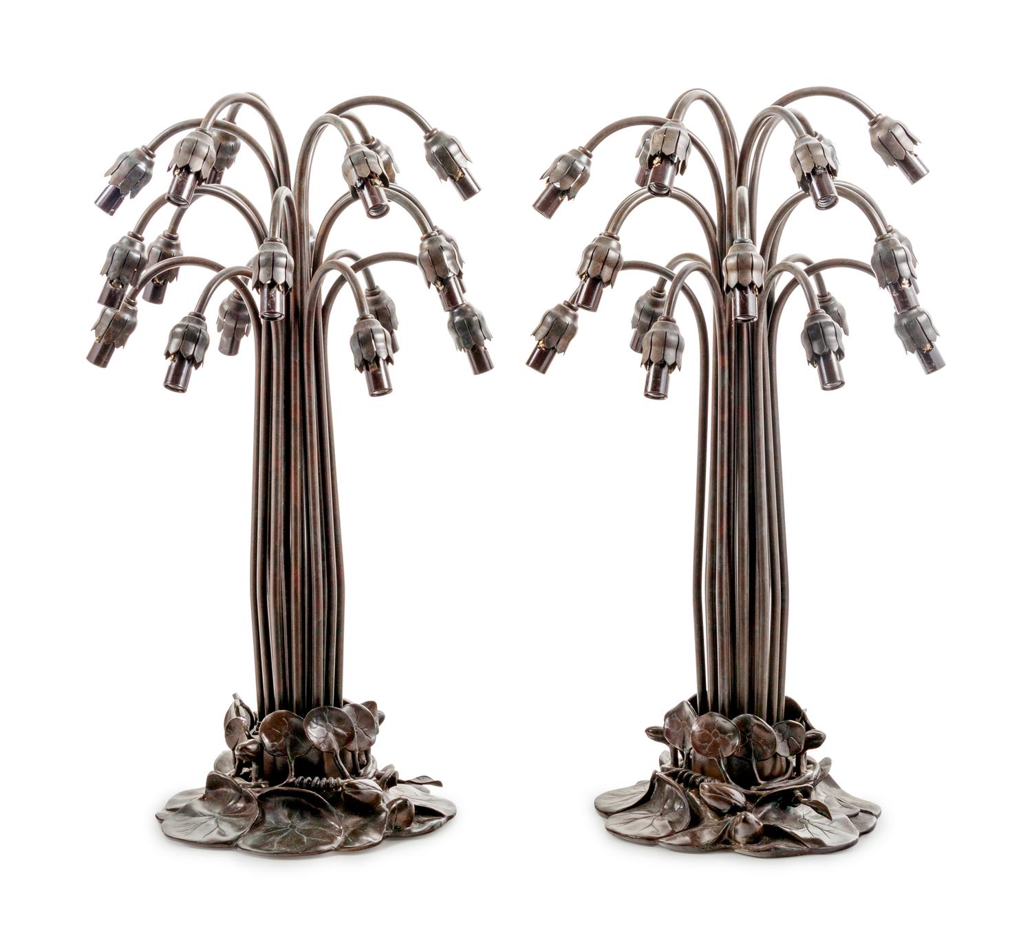 A Pair of Art Nouveau Style Patinated Metal and Iridescent Glass Eighteen-Light Tulip Lamps